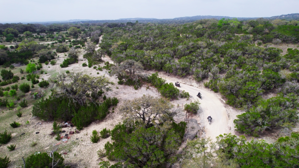 Adventure motorcyclists on caliche road through Texas Hill Country — BDR-X