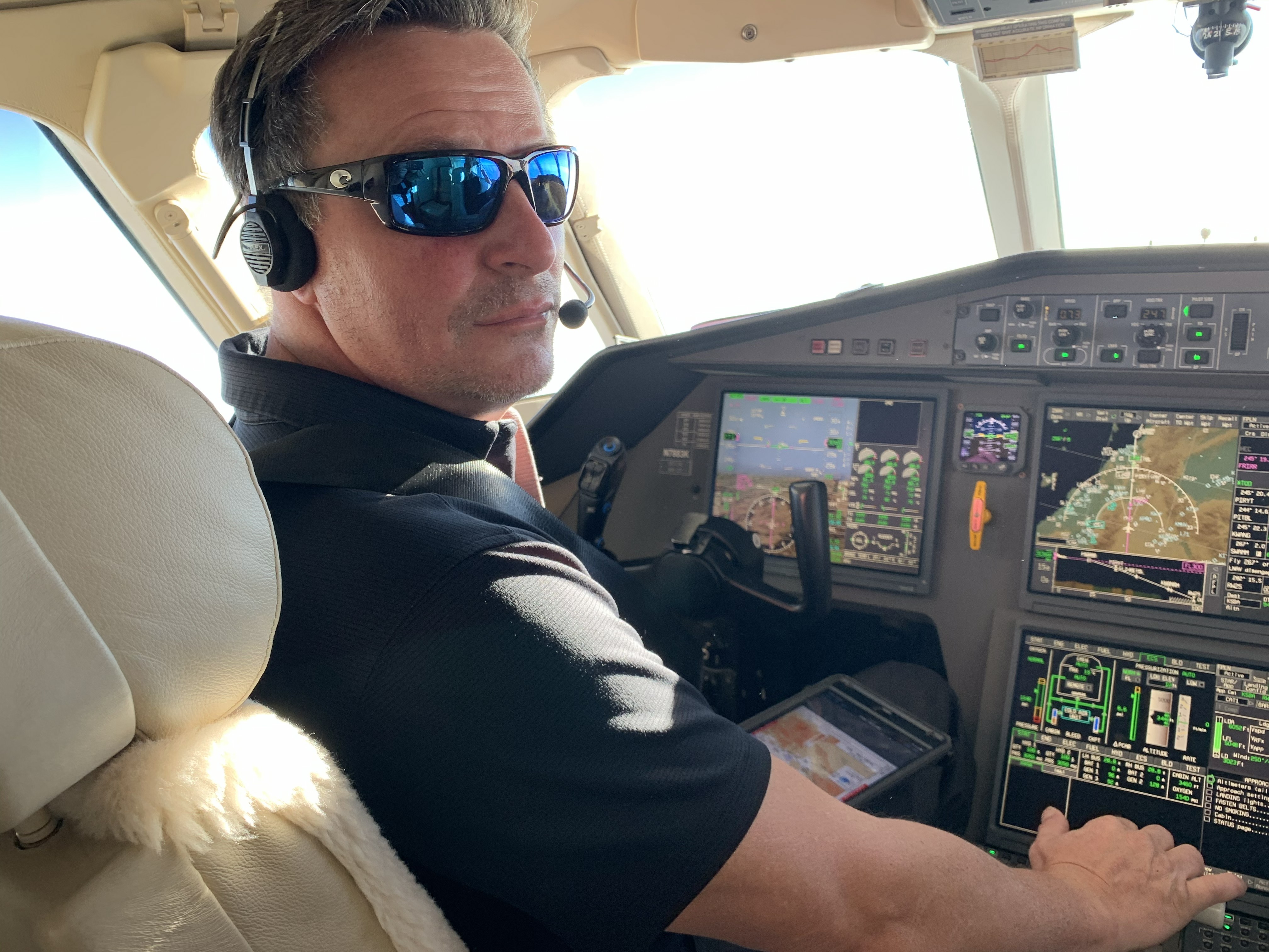 Shawn in the cockpit of his Falcon 7X